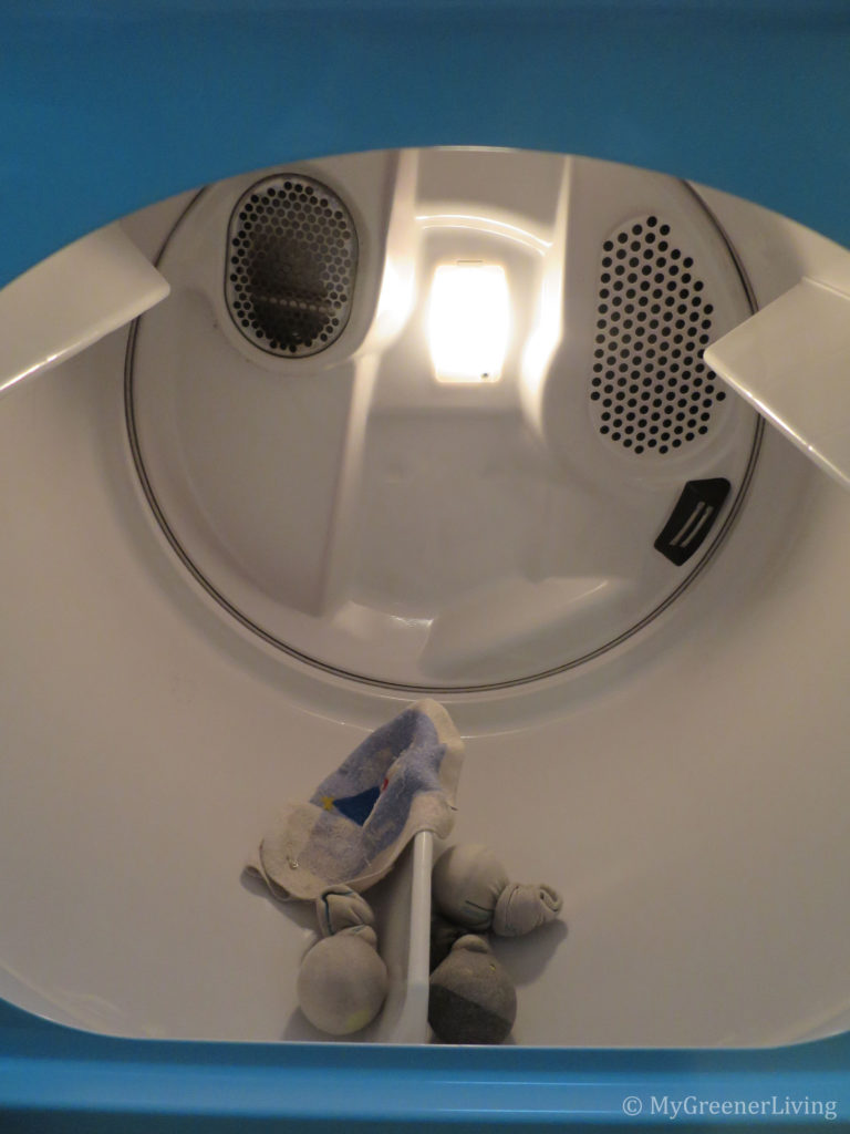 tennis balls and safety pins in a cloth for faster and static-free drying