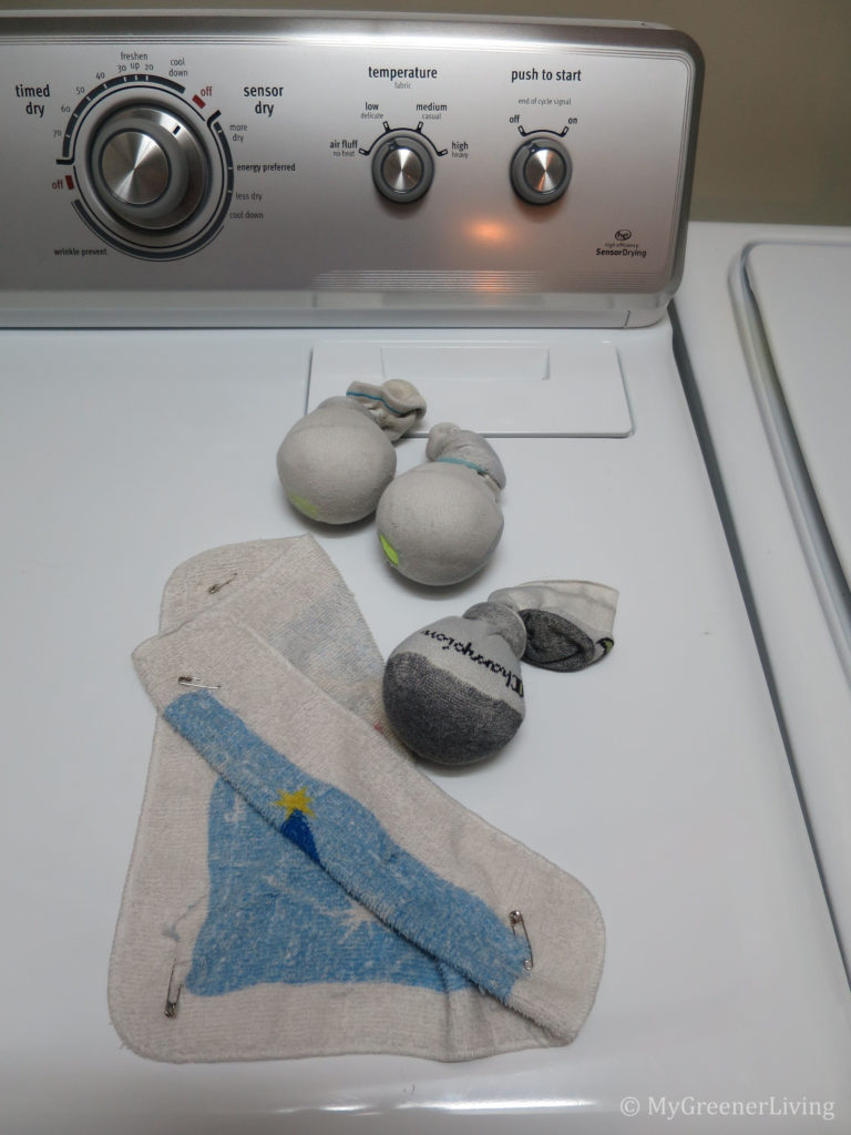 tennis balls and safety pins in a cloth for faster and static-free drying
