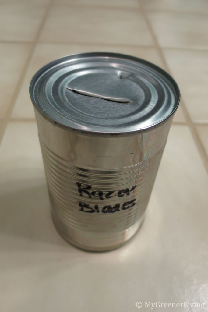 a can with a slit in the top - storage for used double edge safety razors