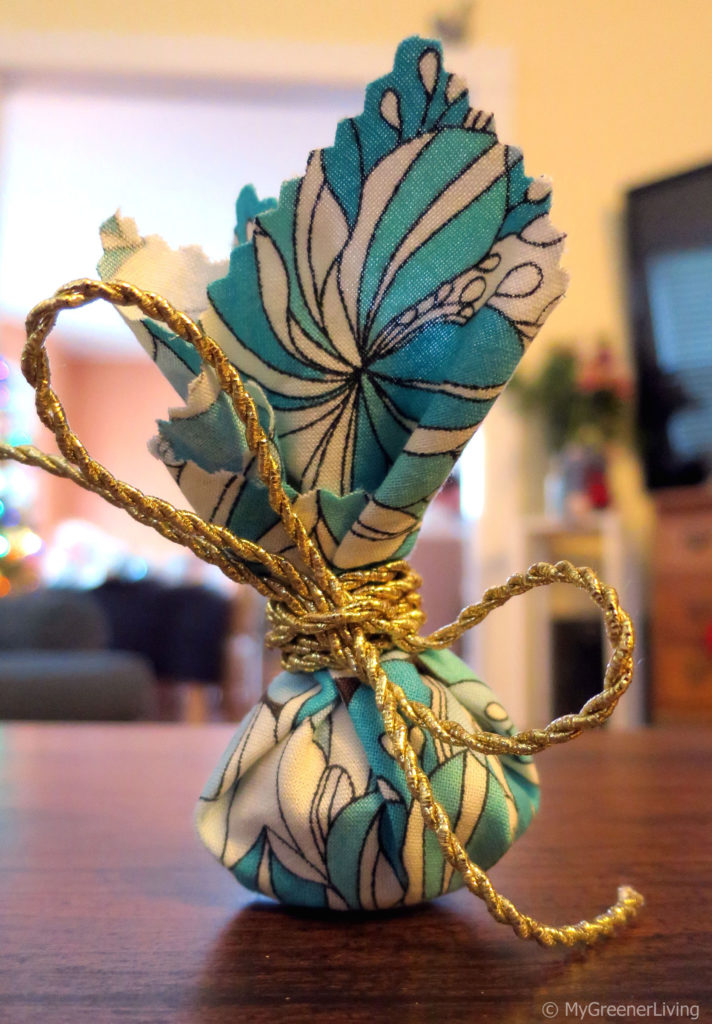 gift wrapped by bundling fabric and tying with a ribbon, like a gift basket