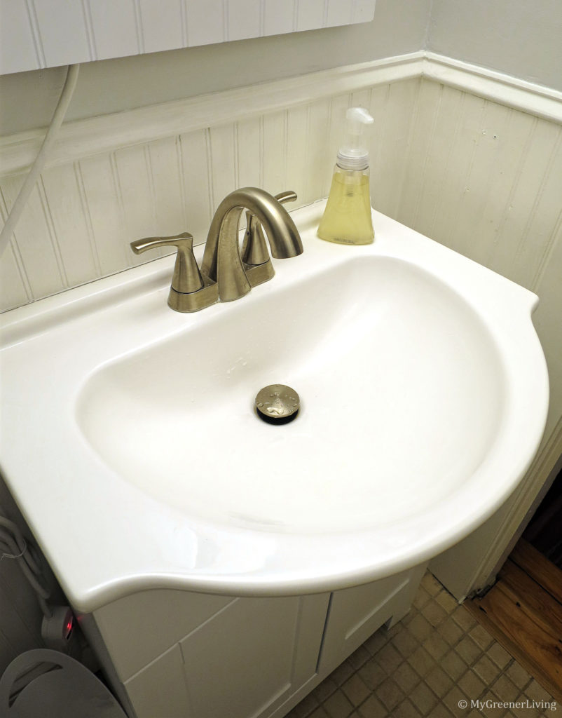 bathroom sink after using baking soda to clean the castile soap scum