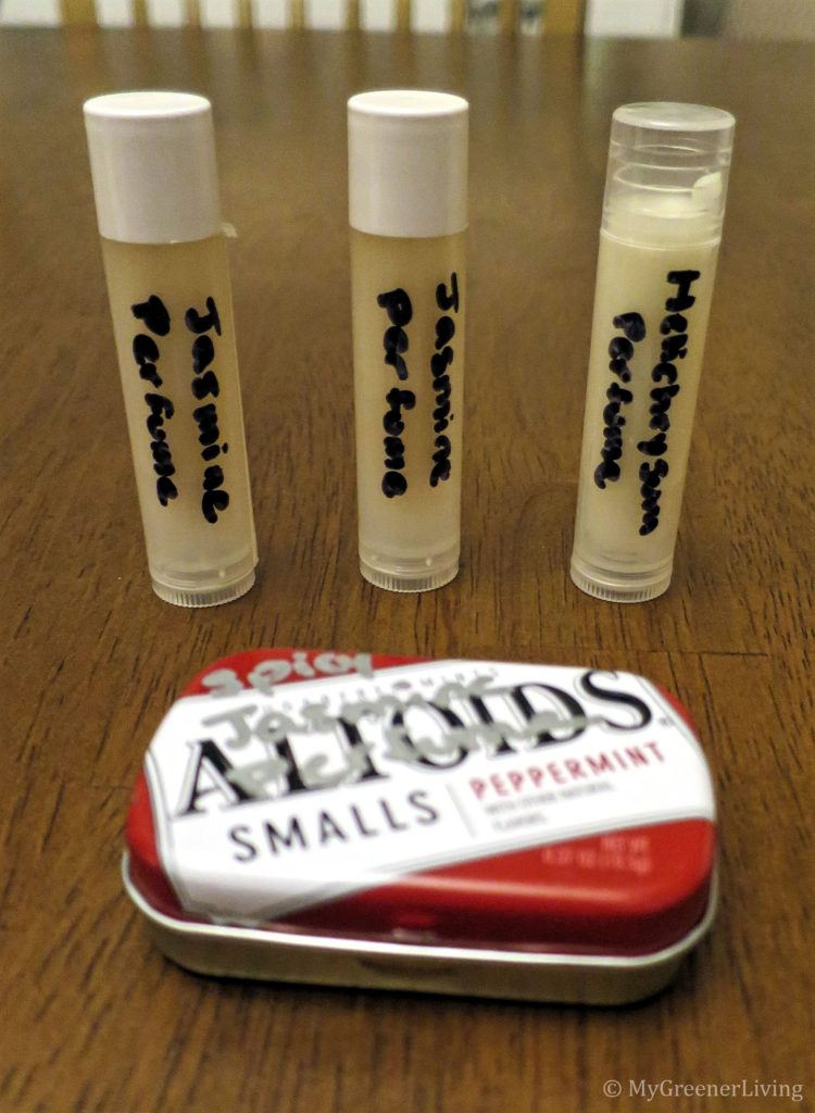 homemade solid perfume in lip balm tubes and a mini Altoids tin