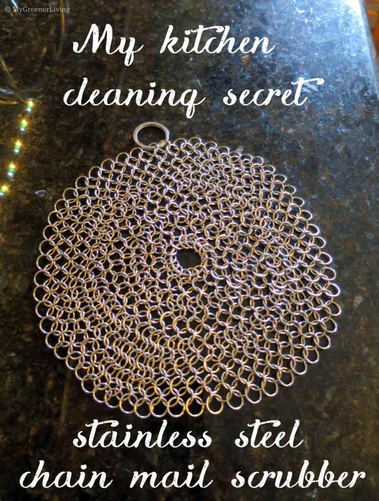 photo of a stainless stell chain mail scrubber on a counter with text "my kitchen cleaning secret stainless steel chain mail scrubber"
