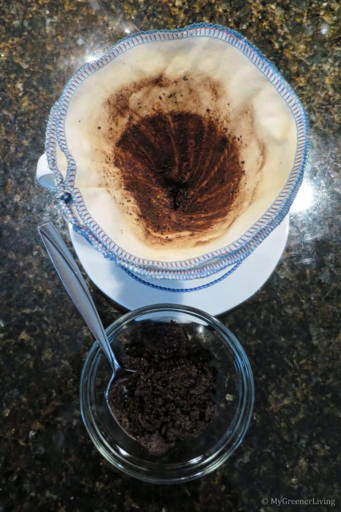 used coffee grounds scooped out of cotton coffee filter into a bowl that will be dumped into compost