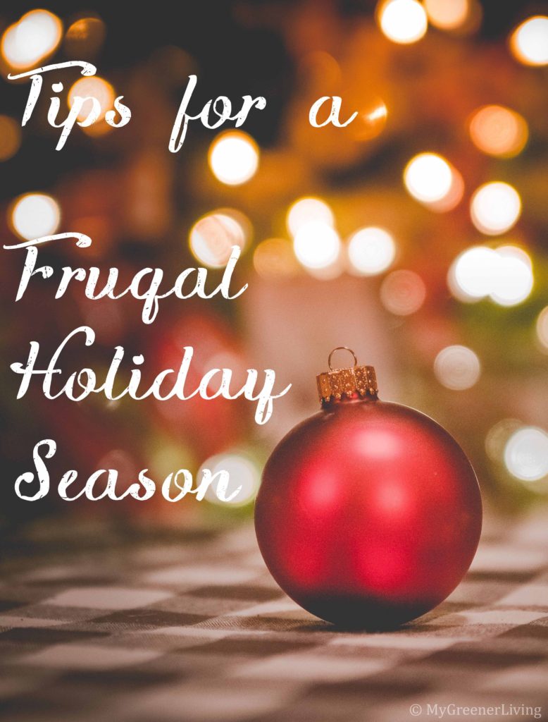 text "Tips for a Frugal Holiday Season" overlaid on an image of a reg globe ornament with Christmas lights out of focus in the background